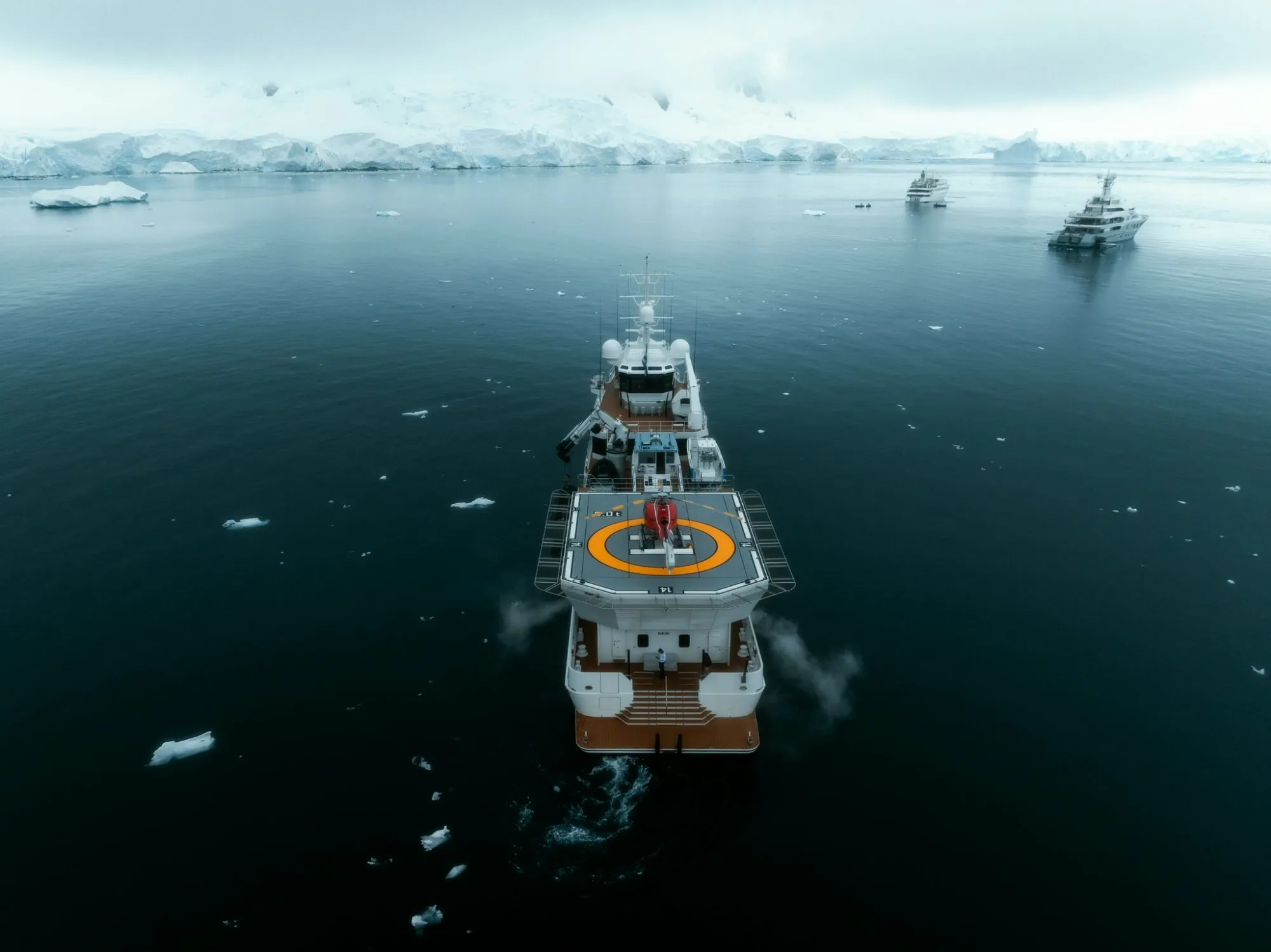 Wolo expedition vessel with helicopter on its helideck, Antarctica